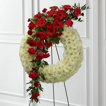 Sympathy wreath with floral tribute