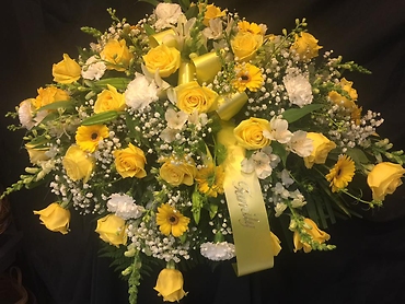 Yellow family casket tribute